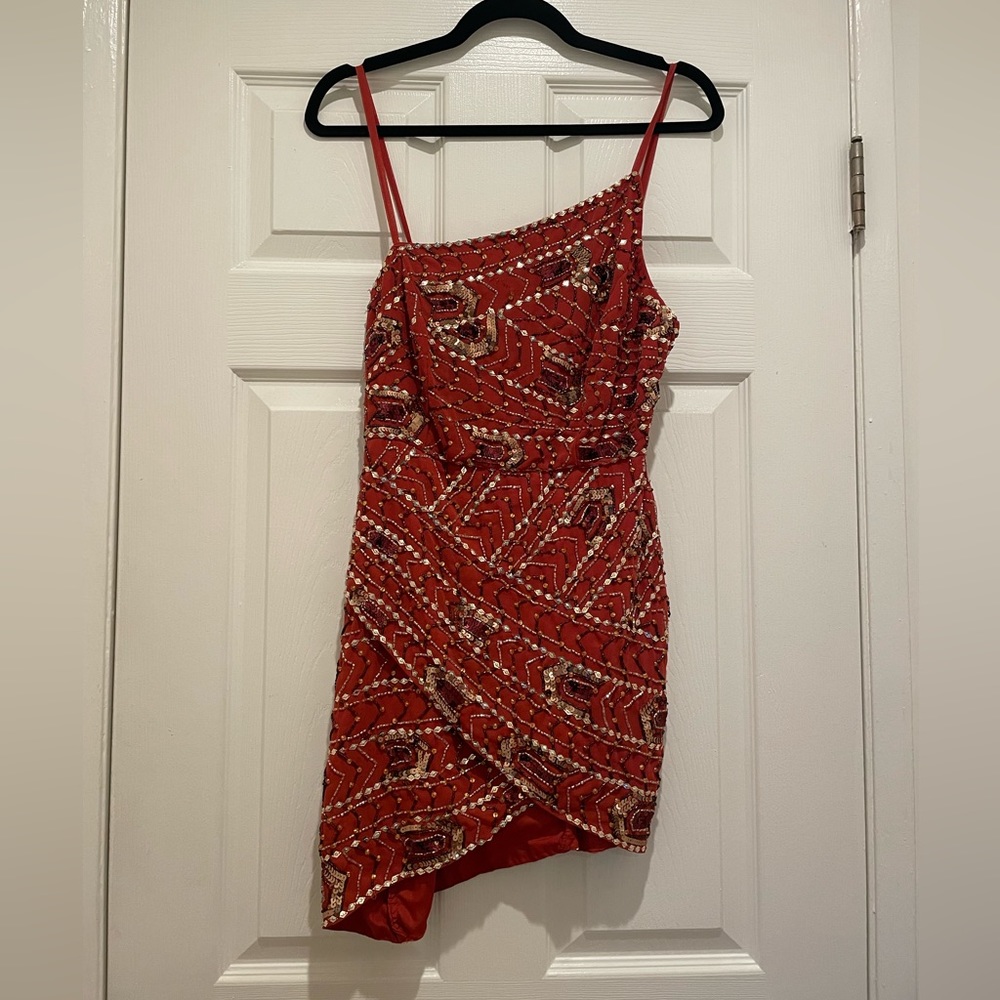 Brand new asymmetric embellished mini dress with wrap skirt